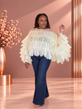 Model wearing an ivory sheer blouse with layered petal details and wide bell sleeves, front view.