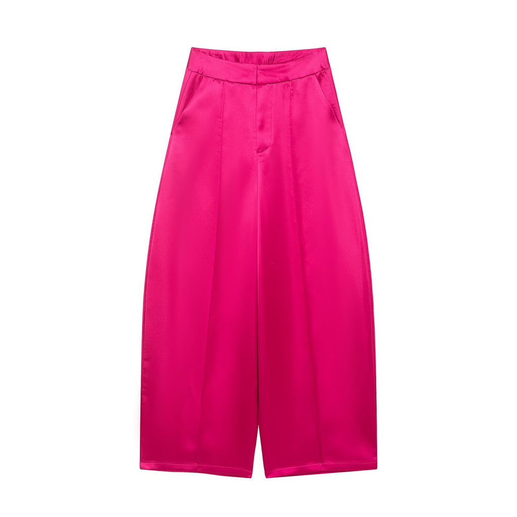 Bright pink satin-look wide-leg pants with a smooth waistband and front pleats, front view.