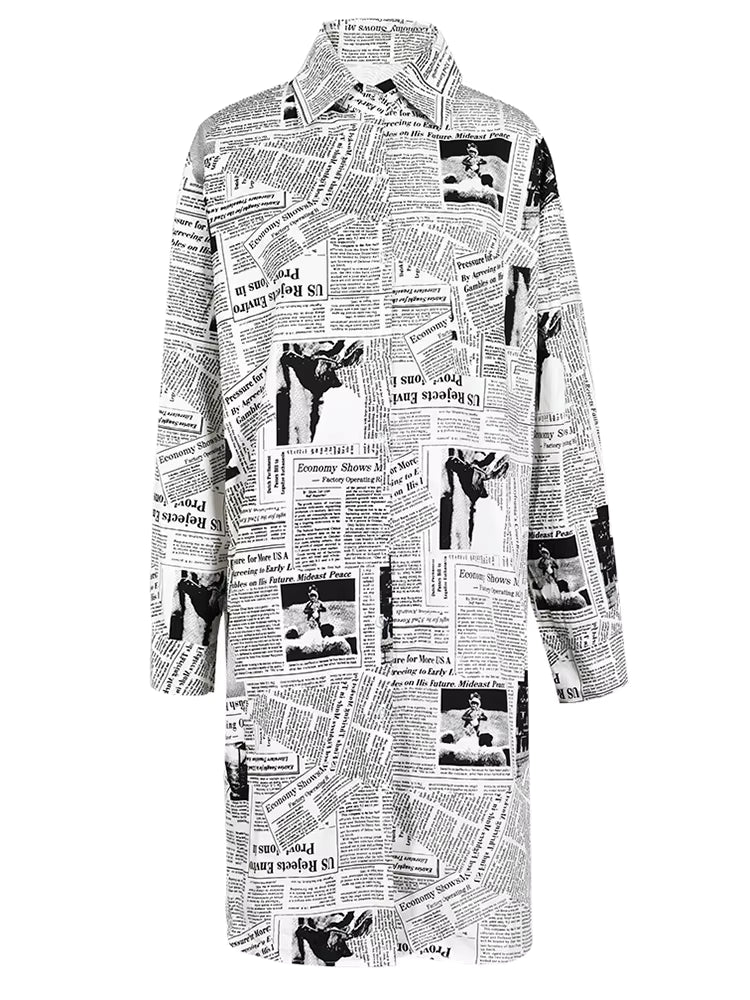 White longline collared shirt covered in black newspaper print, front view.