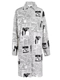 White longline collared shirt covered in black newspaper print, front view.