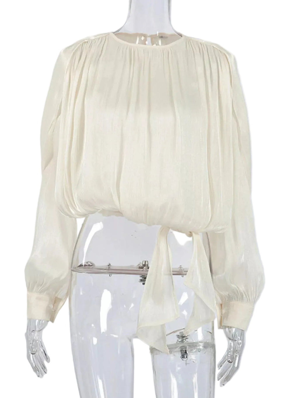 Ivory cropped blouse with a gathered round neckline, balloon sleeves, and long waist ties on a mannequin.