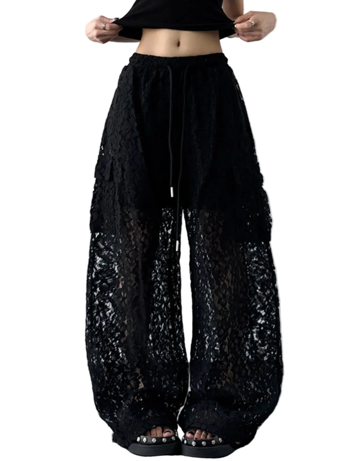 Model wearing black floral lace wide-leg pants with a drawstring waist and short lining, front view.