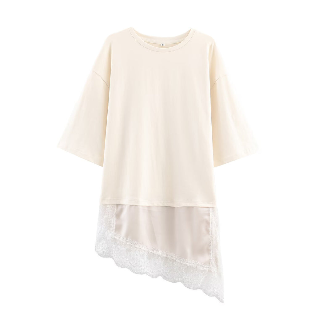 Ivory short-sleeve crewneck T-shirt with an asymmetric sheer lace-trimmed hem, front view.