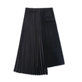 Black asymmetric skirt with a buckle waistband, one pleated panel, and a flap pocket, front view.