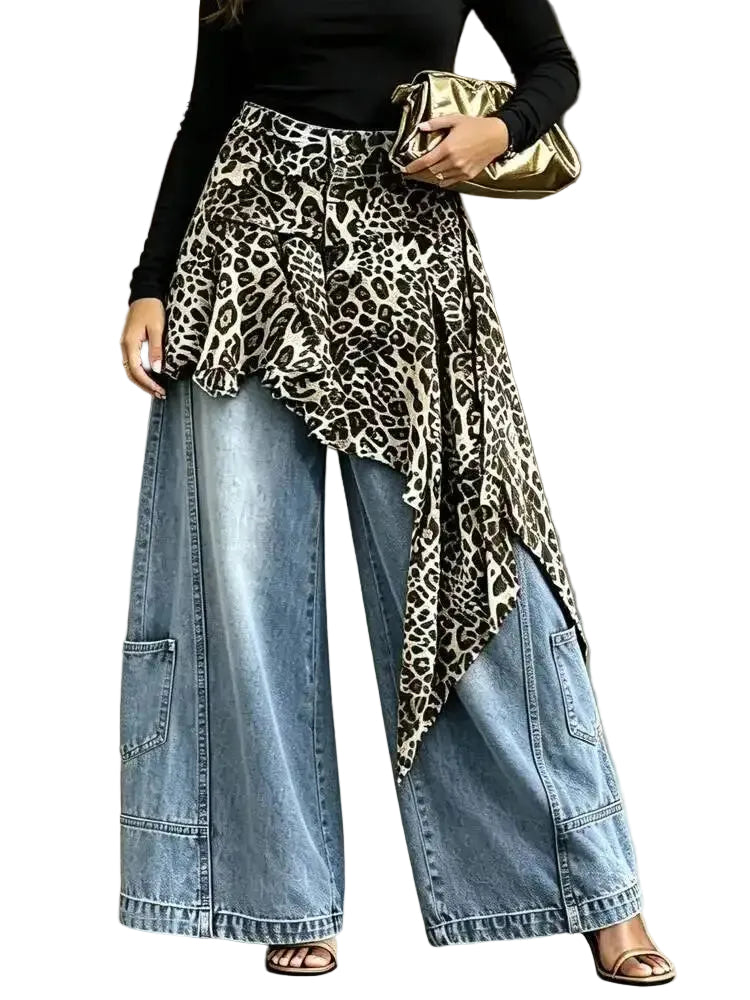 Model wearing light blue wide-leg jeans with an asymmetric leopard-print overlay, front view.