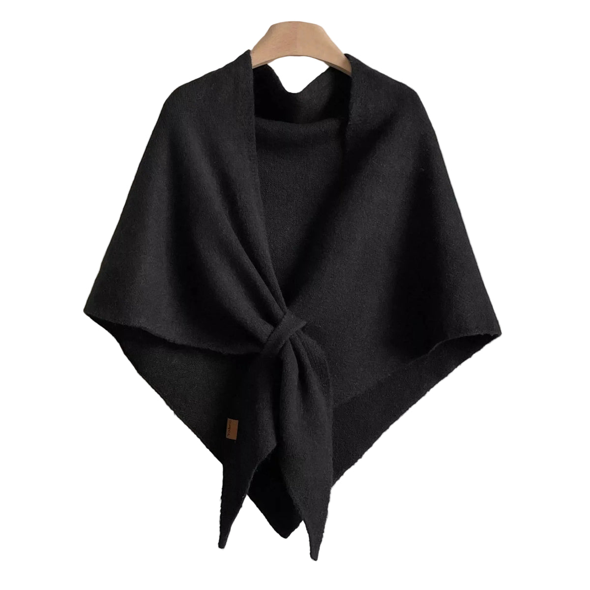 Black knitted wrap shawl with long front ties crossed together, displayed on a hanger.