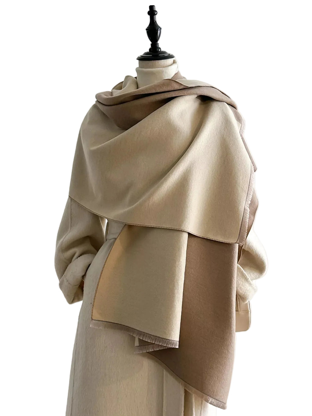 Beige and taupe two-tone scarf with short fringe draped around the shoulders of a mannequin.