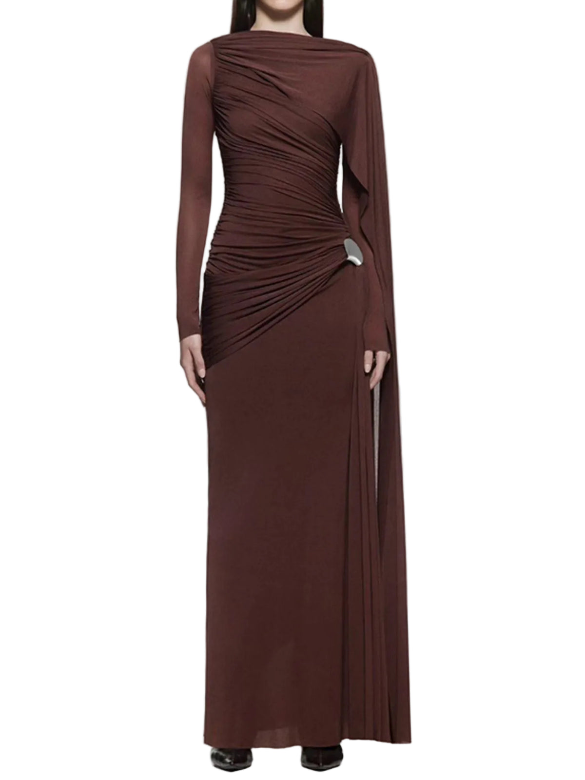 Model wearing a brown long-sleeve ruched gown with a draped shoulder panel and silver hip accent, front view.