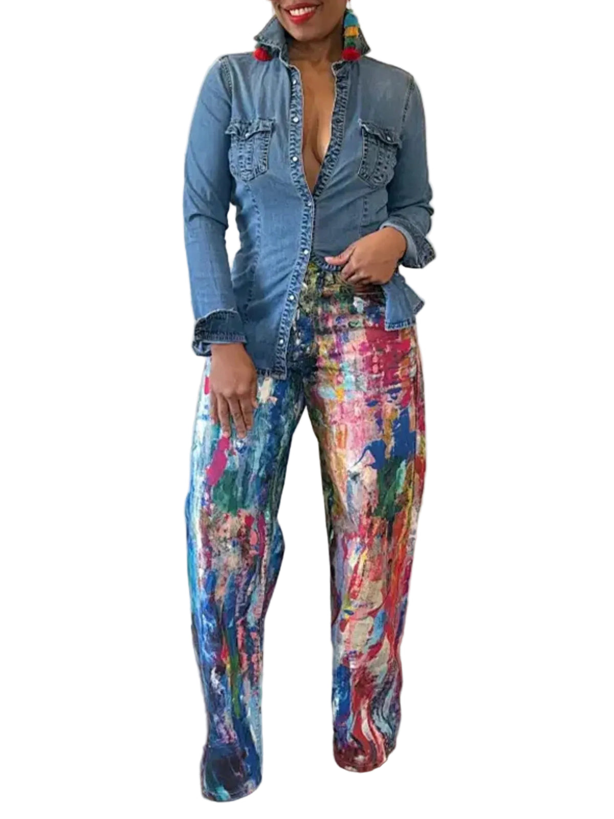 Model wearing multicolor abstract paint-print wide-leg pants with a blue denim shirt, front view.